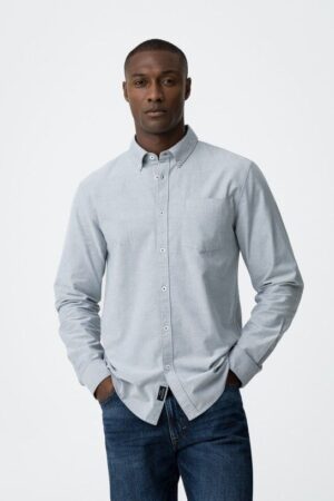 Chemise bleue chinée manches longues Tiffosi homme, coupe ajustée, fermeture à boutons, poche sur la poitrine, 100% coton. Disponible du S au XXL. Livraison rapide et retours gratuits