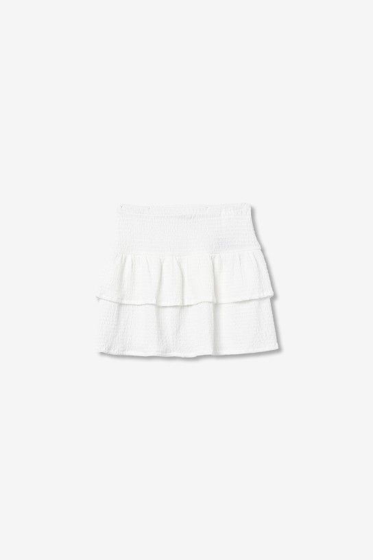 Jupe courte blanche à volants pour ado fille Tiffosi, tissu mousseline gaufrée et taille élastique, collection printemps été 2026 boutique Casual Sénas.