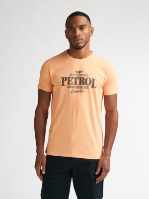 T-shirt manches courtes homme Petrol Industries orange tropical, coton bio 180g/m², logo graphique vintage, collection été 2026 boutique Casual Sénas (13560).