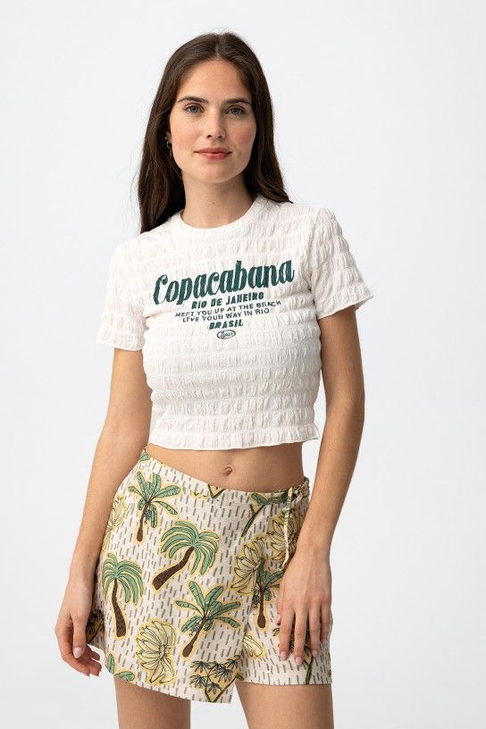 Crop top blanc gaufré pour ado fille avec logo vert Copacabana, marque Tiffosi, disponible chez Casual Sénas.