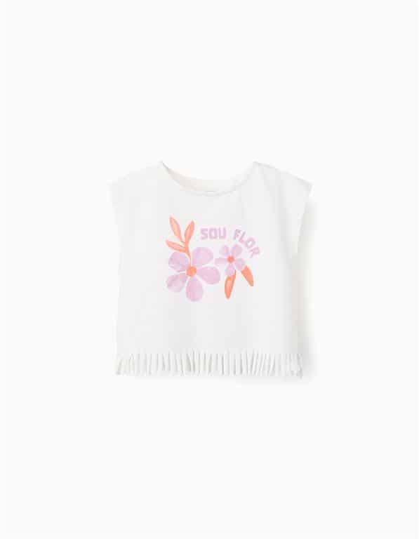 Débardeur blanc pour fille en coton avec coupe large, logo fleuri et bas à franges, marque Zippy, nouvelle collection chez Casual Sénas.